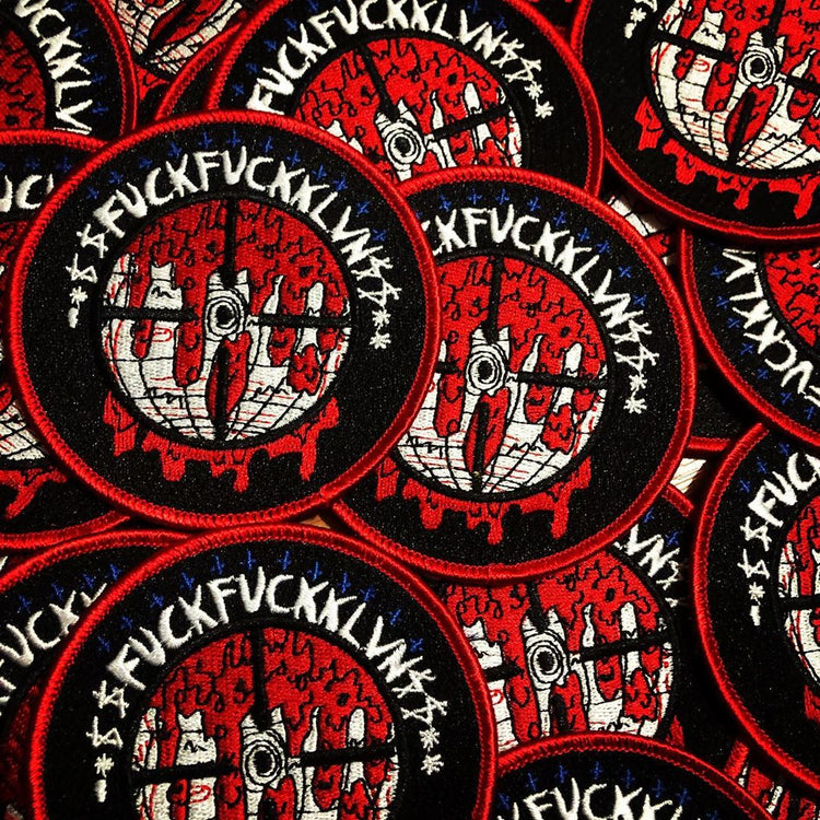 A collection of patches with a FFK design, featuring a stylized graphic of a globe with red blood dripping and the text 'FFK' prominently displayed.
