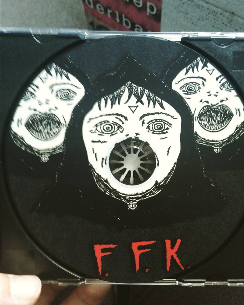 Compact disc with black and white illustration of high priests and 'FFK' text on a clear case.